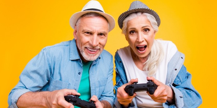 Older couple using a Playstation