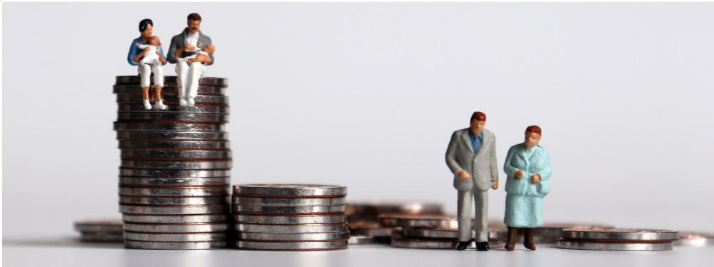 Small plastic figures of people standing on top of piles of coins