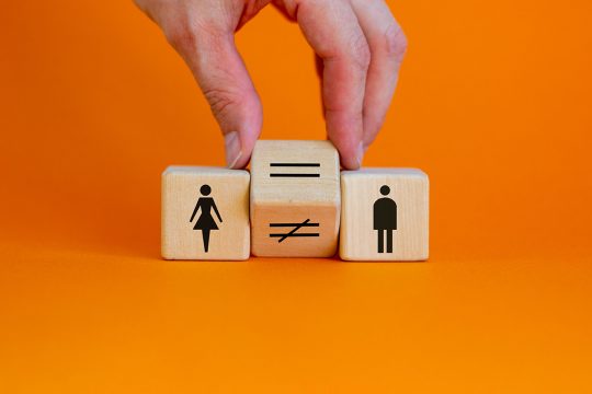 Symbols of a woman, equals sign and a man