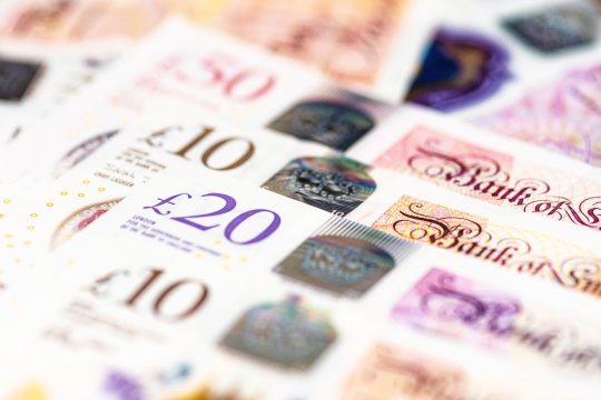 Macro image of several GBP notes issued by the Bank of England