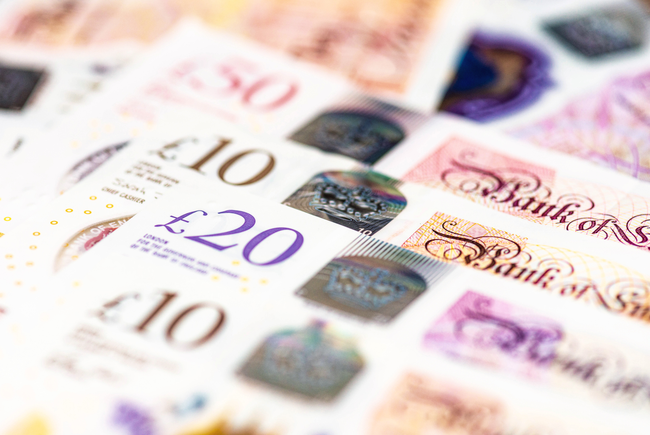 Macro image of several GBP notes issued by the Bank of England