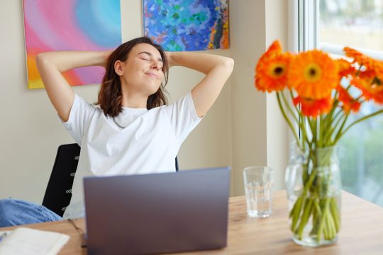 Woman feeling happy after work is done.