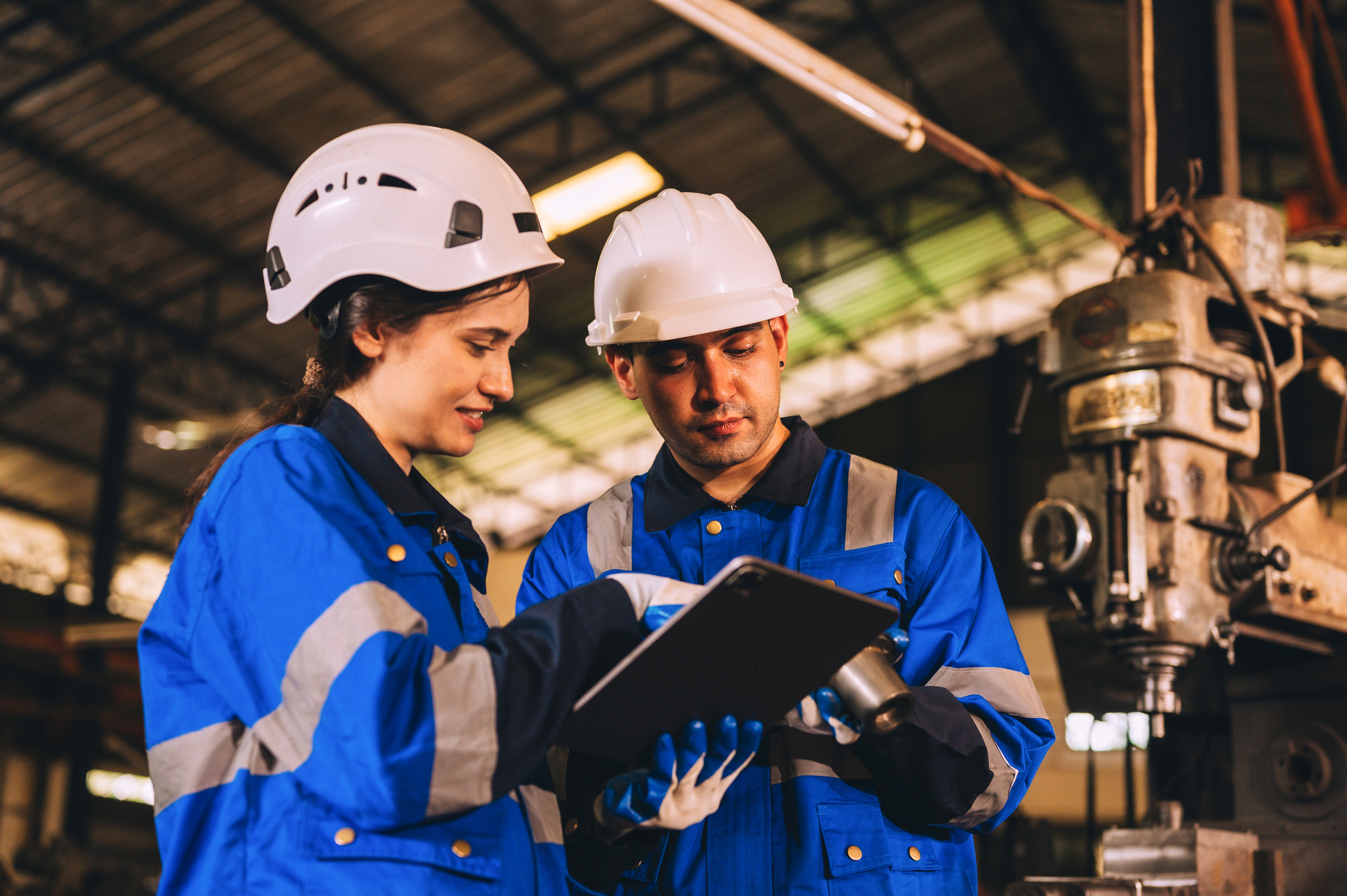 Man and woman professional robot engineer work together