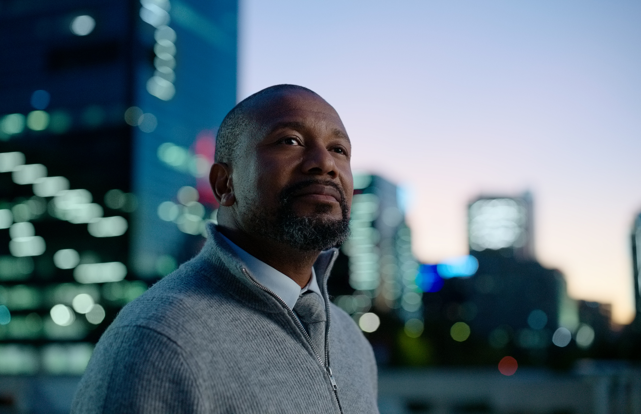 Businessman, thinking and night city with view