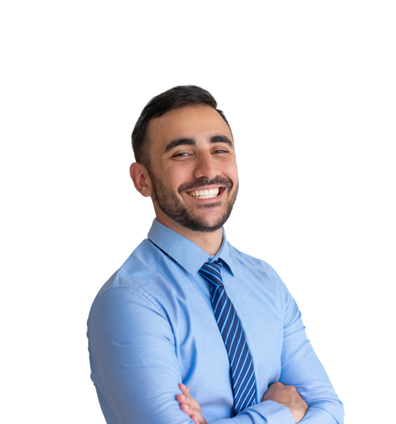 A cut-out of a young white man smiling with his arms folded