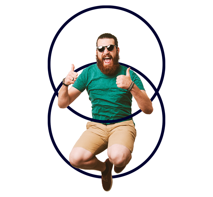 A cut out of a white man jumping mid-air smiling with both thumbs up