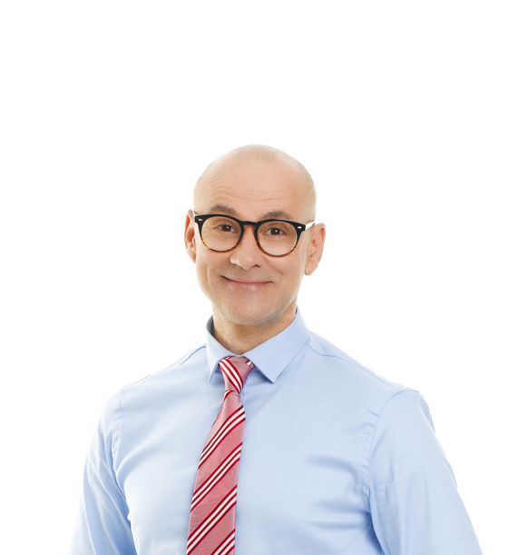 man wearing glasses and tie smiling at the camera