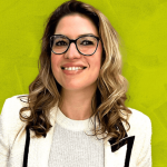 Woman in business attire smiling
