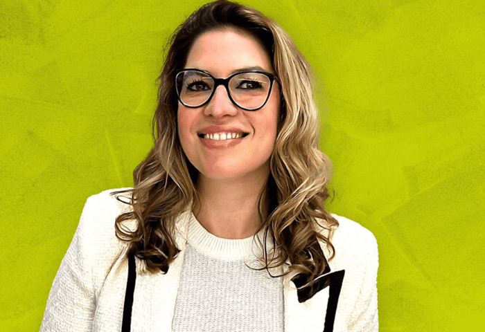 Woman in business attire smiling