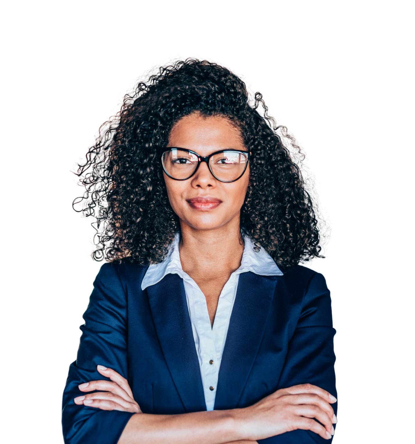 Smiling woman in business attire facing the camera with arms crossed