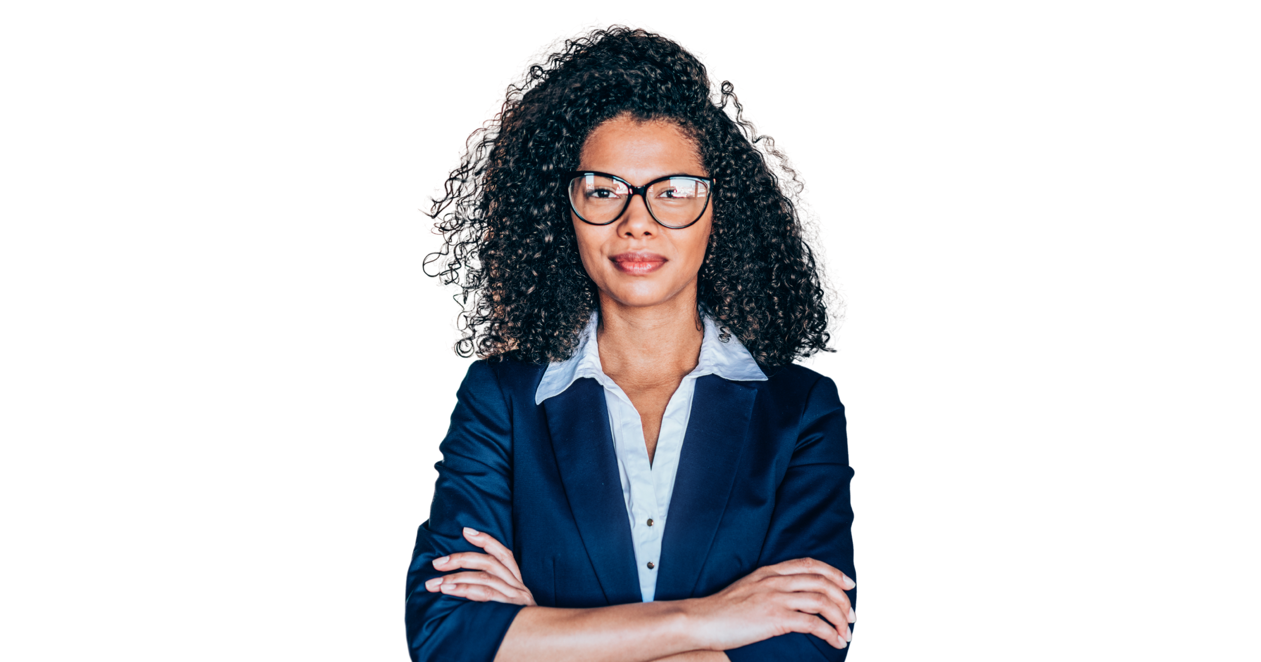 Smiling woman in business attire facing the camera with arms crossed
