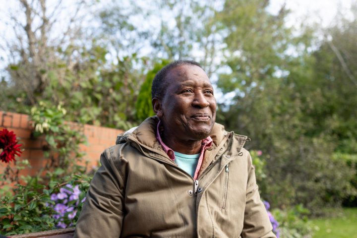 Content Senior Man Sitting in the Garden