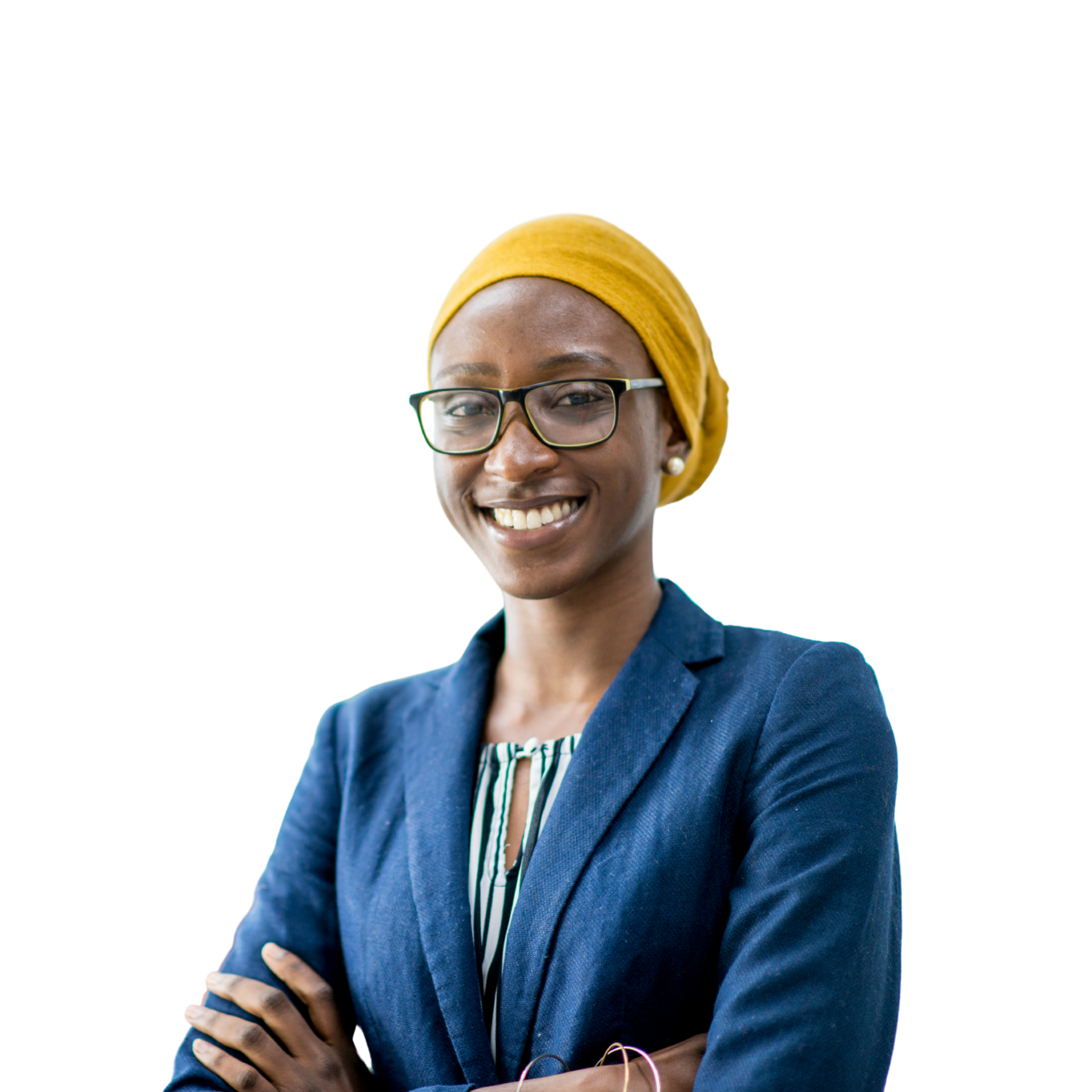 Smiling woman in business attire facing the camera with arms crossed