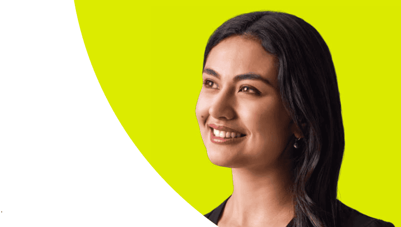 Cut out of a brown woman smiling looking off camera