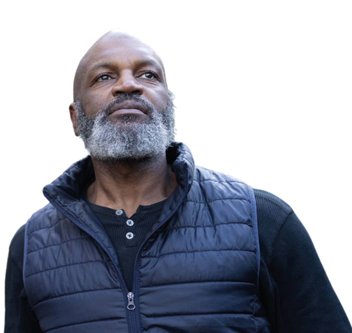 Man wearing blue jumper looks serious